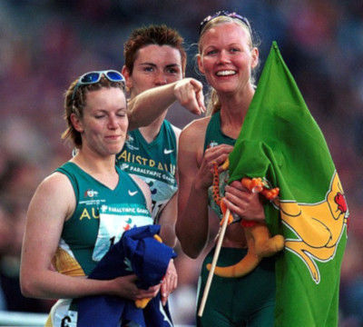 Australian athletes hold the Boxing Kangaroo flag at the 2000 Summer Olympic Games in Sydney, Australia